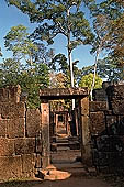 Banteay Srei temple - ruins of a minor building by the side of the causeway